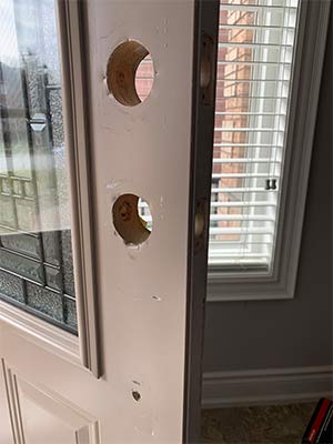 Door with holes drilled for lock hardware